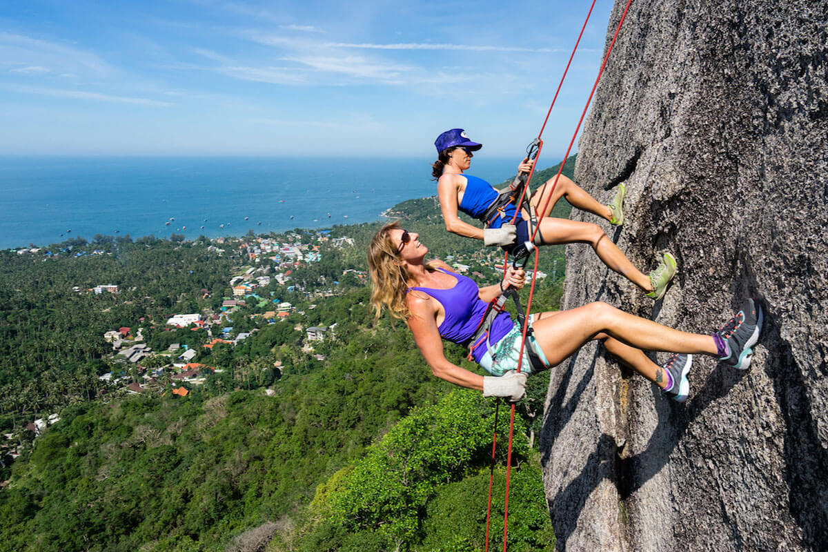 Two Beautiful and Attractive Woman Climbing a Mountain