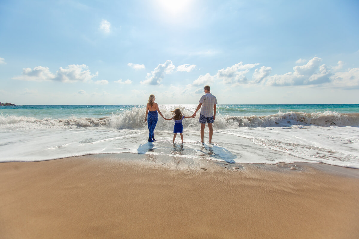 Image Showing A Beautiful Family Enjoying their vocation in the beach