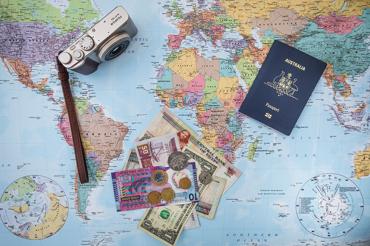 Image of Travel map with passport, money and camera.