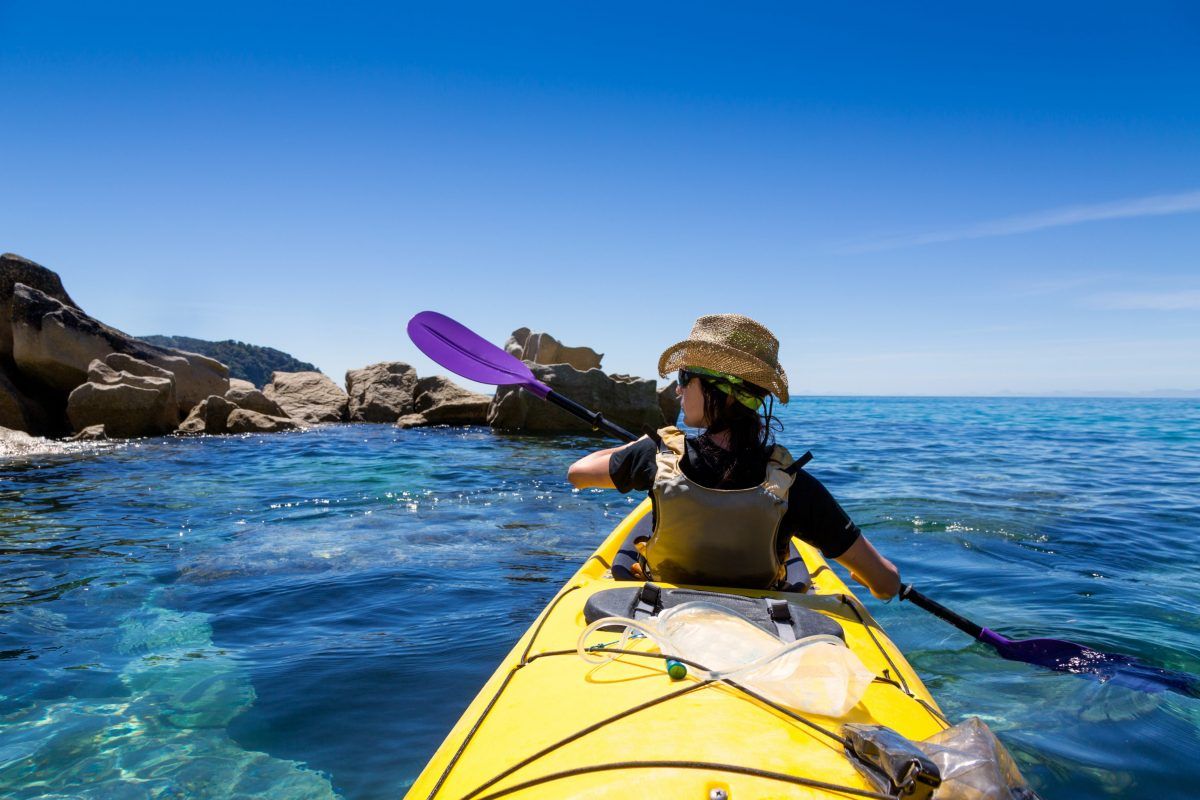 A Woman Hiker Enjoying Her Kayaking Tour