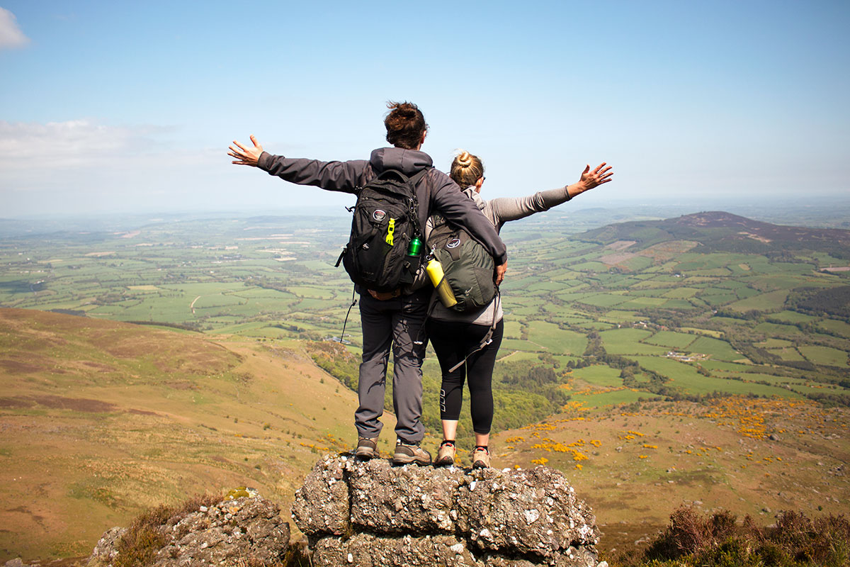 Image Represents A Couple Relaxing In The Top of The Mountain