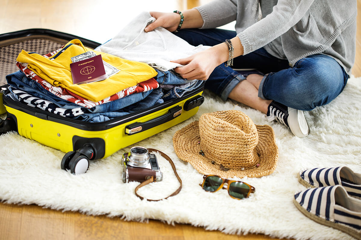 Portrait of Woman Packing Her Stuffs For Travel